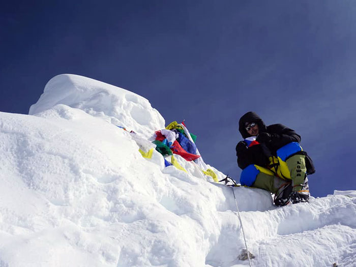 member at the summit of manaslu