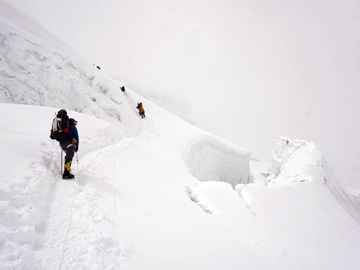 members climbing up to high camp