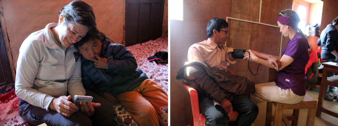 Dr. Jen showing photos Cindy checking patients