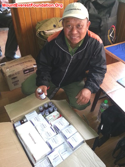Krishna Rana Magar, showing some of the 50 kgs of medicines we are bringing for the service trek. Photo by Deha Shrestha