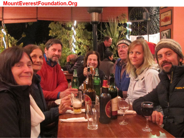 Service trek team enjoys dinner at Kathmandu's wonderful Italian restaurant Fire and Ice Pizza. left to right: Shelley Bloom, (nurse practitioner from Usa), Marie Series-Michaud (nurse from France), Wolfgang Nicola (physical therapist from Germany), Anne Kates (educator from Canada), Dan Mazur (educator from Bristol, England, and Seattle, Usa), Daniela Milea (psychologist from Romania), Jeremy Smith (EMT, Australia). Photo by awesome waiter.